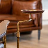 Cassis Leather Cigar Chair with top-grain leather upholstery, built-in cigar plate, and mid-century industrial iron legs for modern interiors